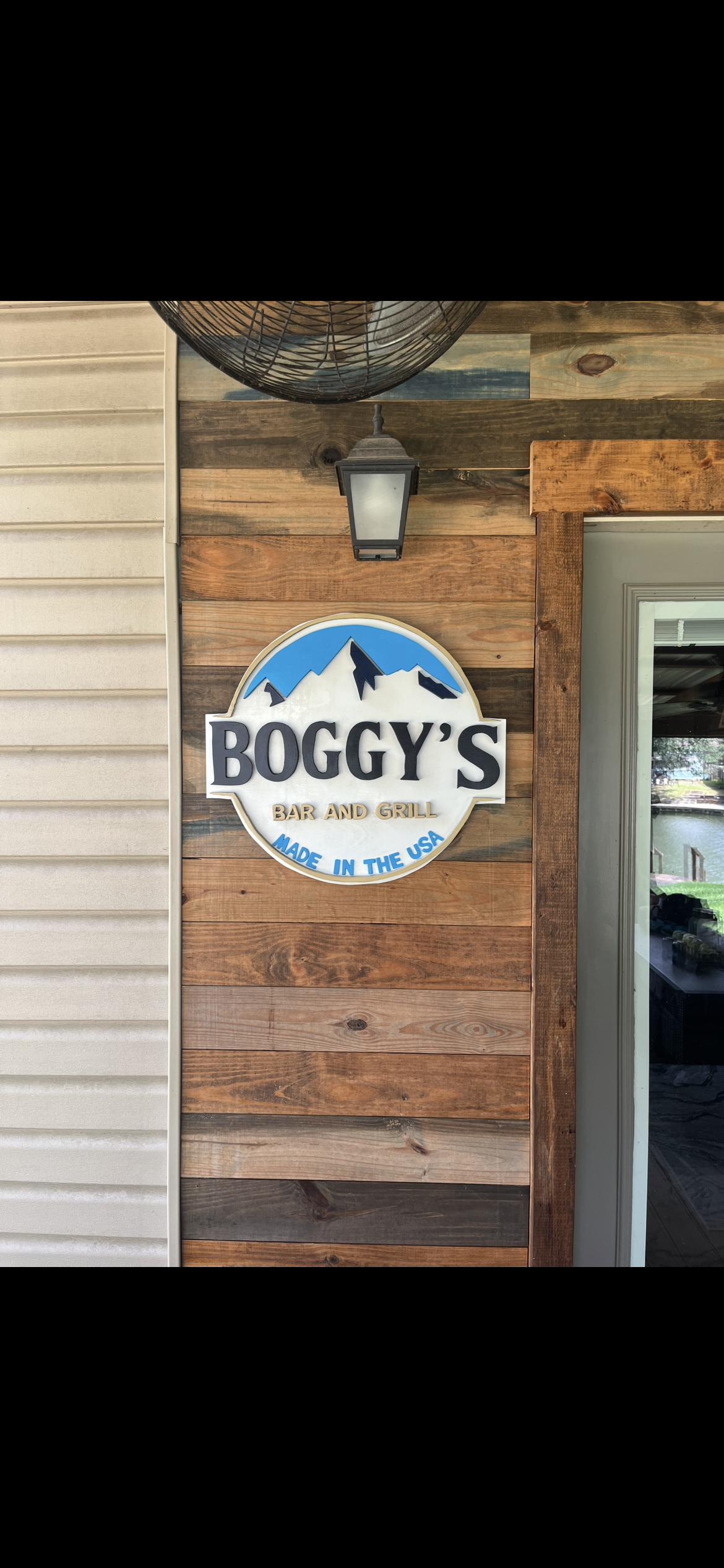 'Boggy's' family name sign with layered mountains and gold trim, example of custom handmade wood work