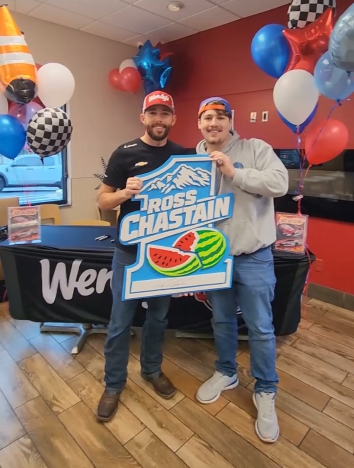 Ross Chastain signing the #1 sign our shop built and delivered to him in person