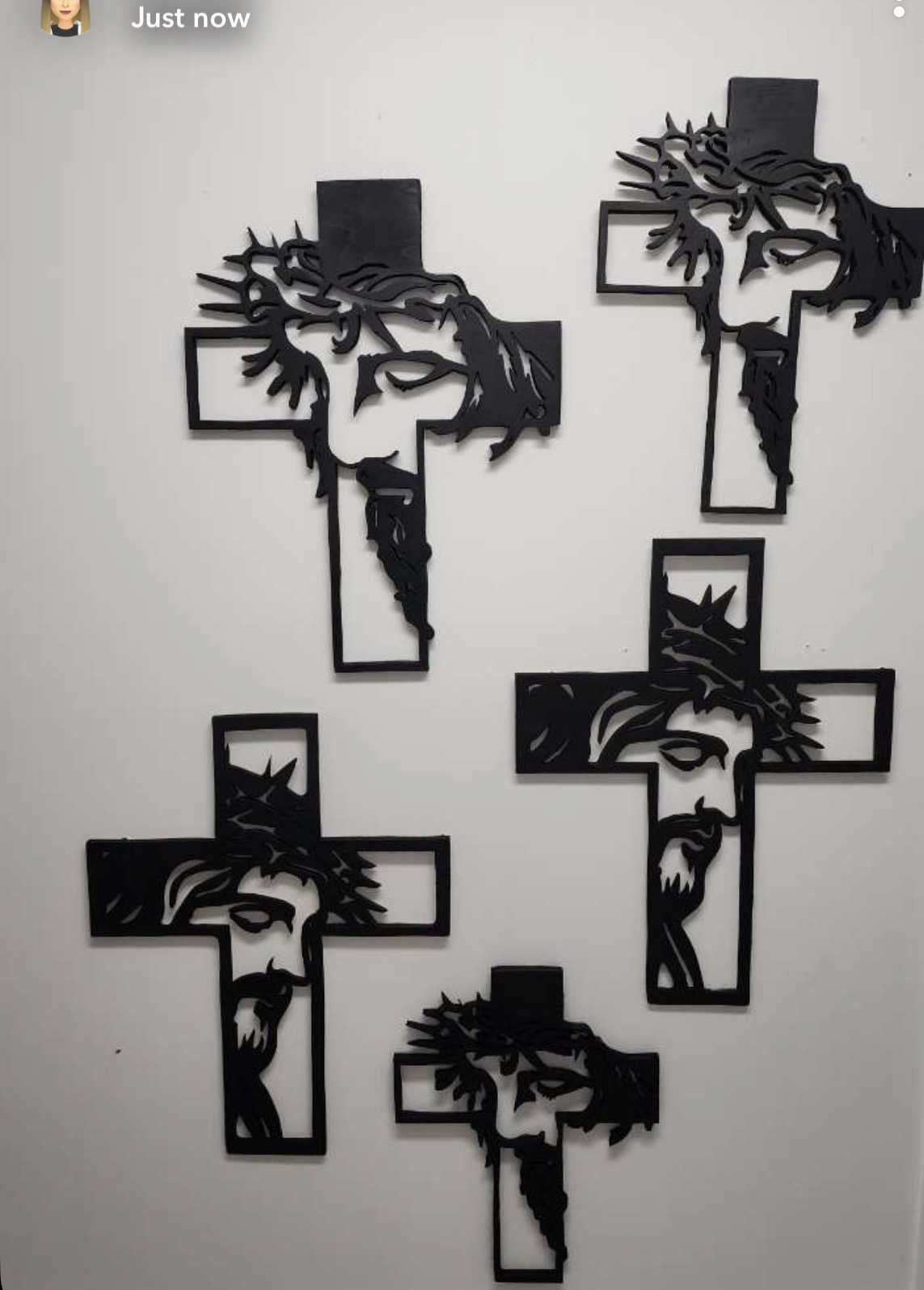 Five hand-cut wooden crosses with a crown of thorns silhouette