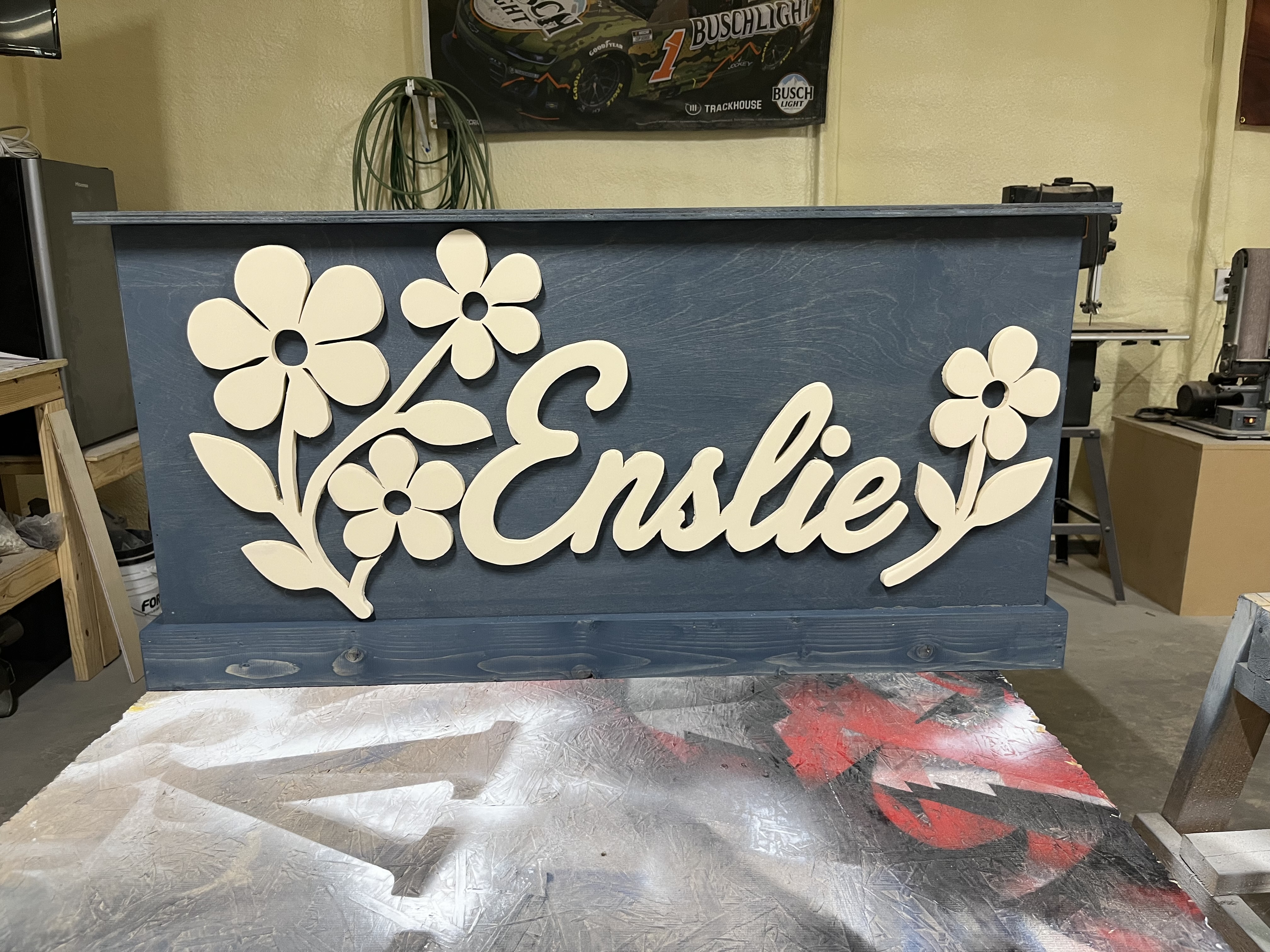 'Ensliey' toy box in weathered blue with hand-cut daisies and raised script