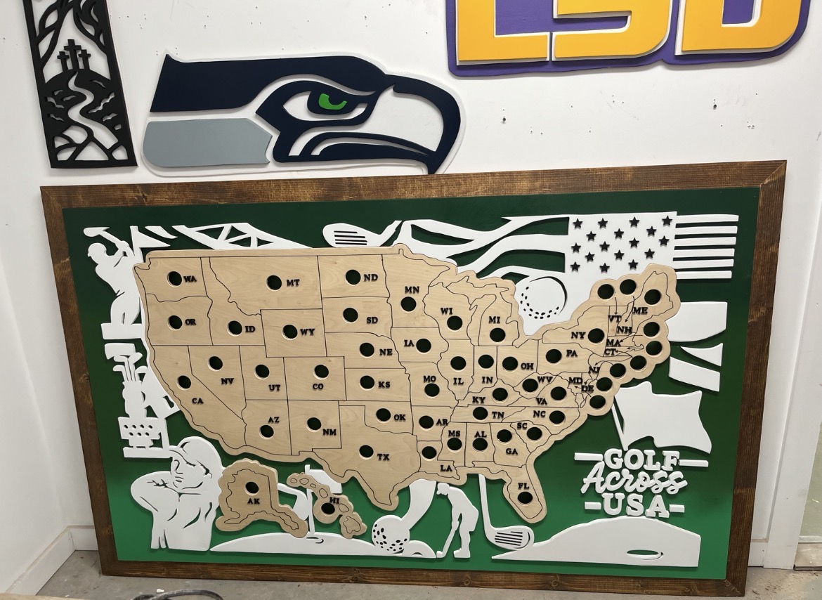 Golf Across USA board in the shop, freshly assembled with hand-cut golfer silhouettes and state pockets