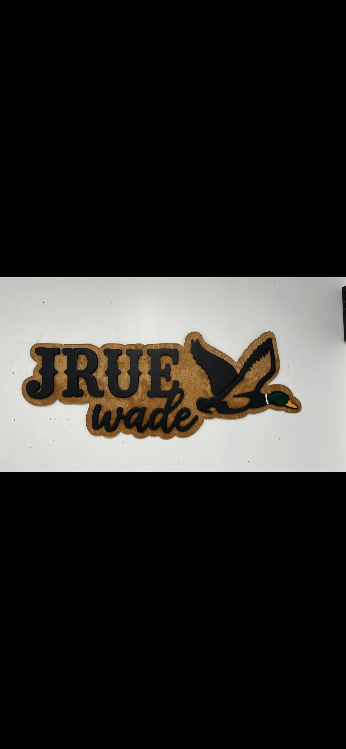 'Jrue Wade' nursery name sign for a child's room, with a hand-cut mallard in flight