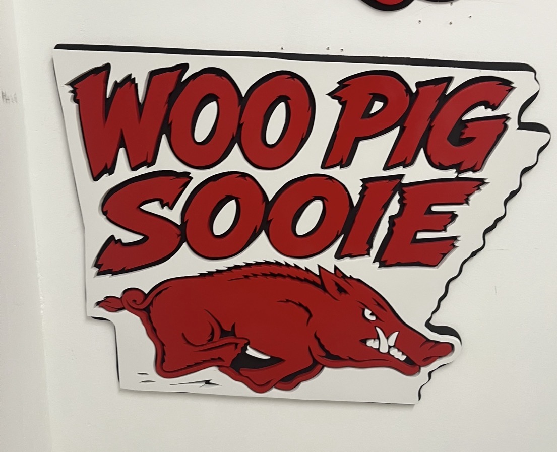 A smaller Razorback state sign with a shadow-layered hog
