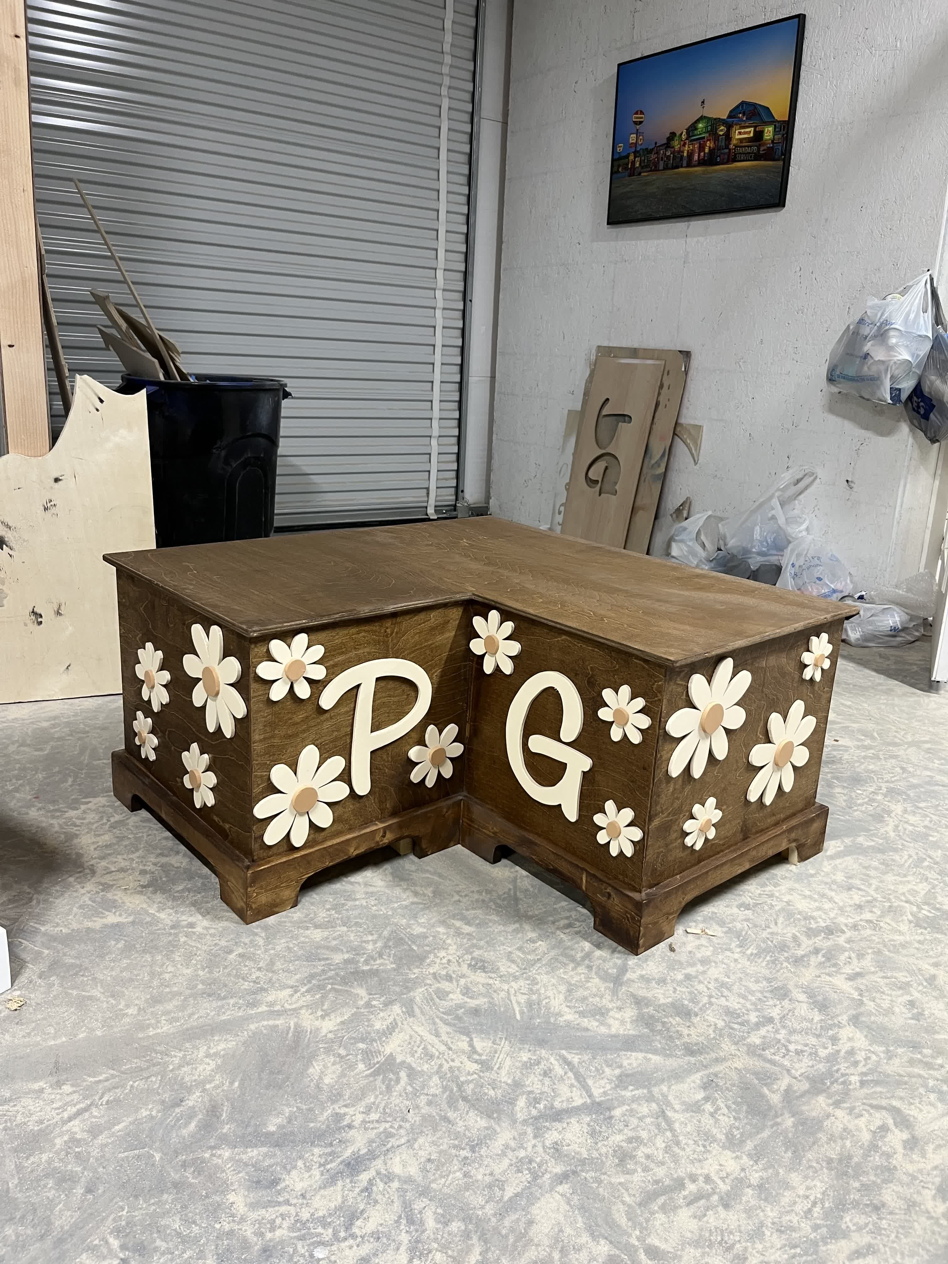 Stained monogram toy box wrapped in hand-cut daisies on every side